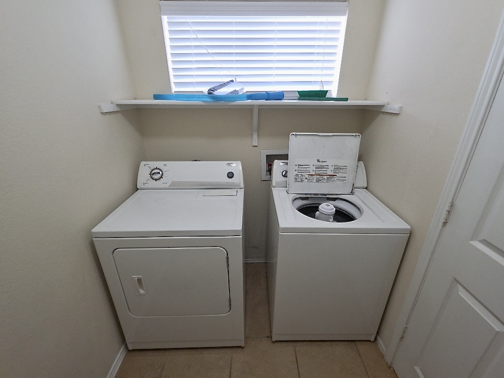 204 Ruby Lake Drive Kyle, TX 78640 - Photo 20 of 22 Laundry room with washing machine and dryer