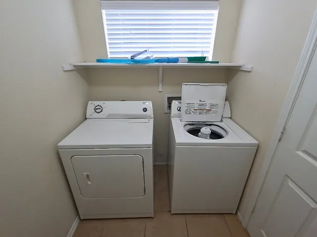 a utility room with dryer and washer
