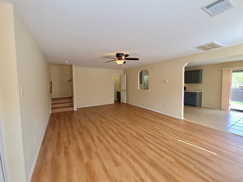 204 Ruby Lake Drive Kyle, TX 78640 - Photo 5 of 22 Living room with a ceiling fan