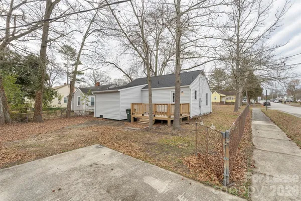 a view of a house with a yard covered in snow
