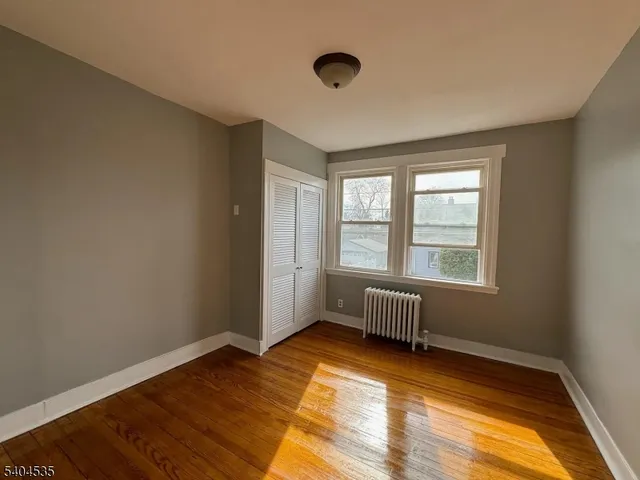 a room with bed and window
