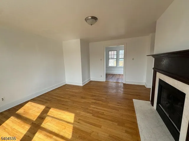 a bedroom with a bed and a television