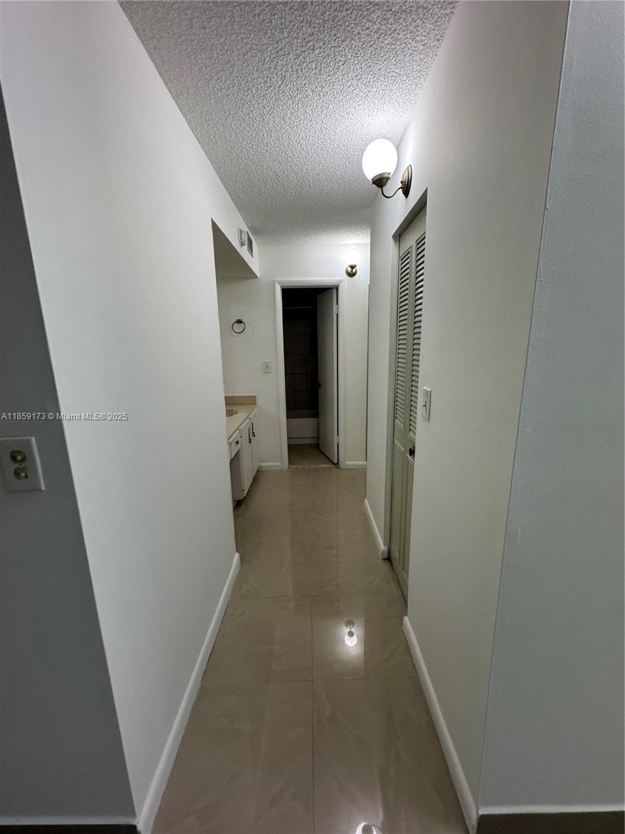 6841 Southwest 147th Avenue, Unit 1H Miami, FL 33193 - Photo 15 of 26 a view of a hallway