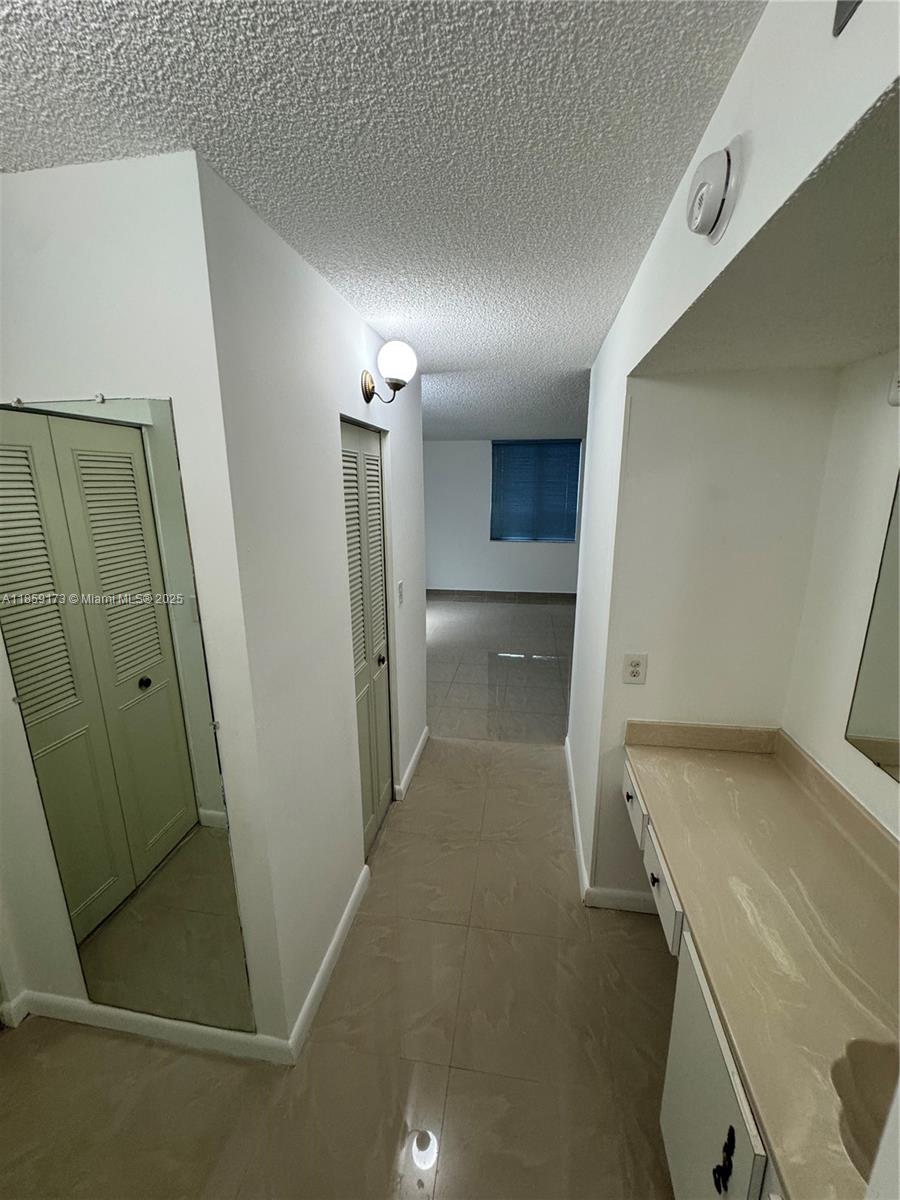 6841 Southwest 147th Avenue, Unit 1H Miami, FL 33193 - Photo 20 of 26 a view of hallway