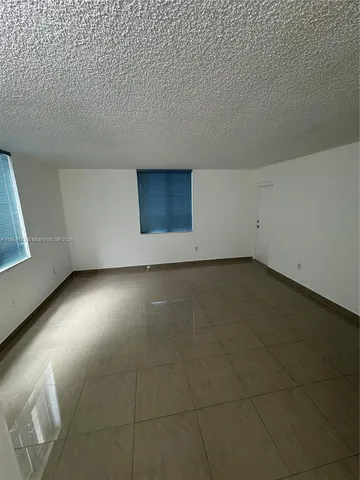 view of an empty room with closet