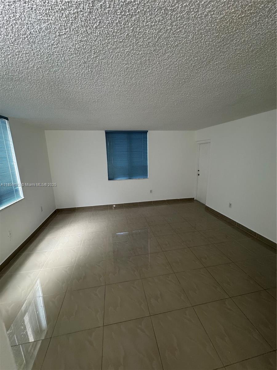 6841 Southwest 147th Avenue, Unit 1H Miami, FL 33193 - Photo 21 of 26 a view of room and hallway
