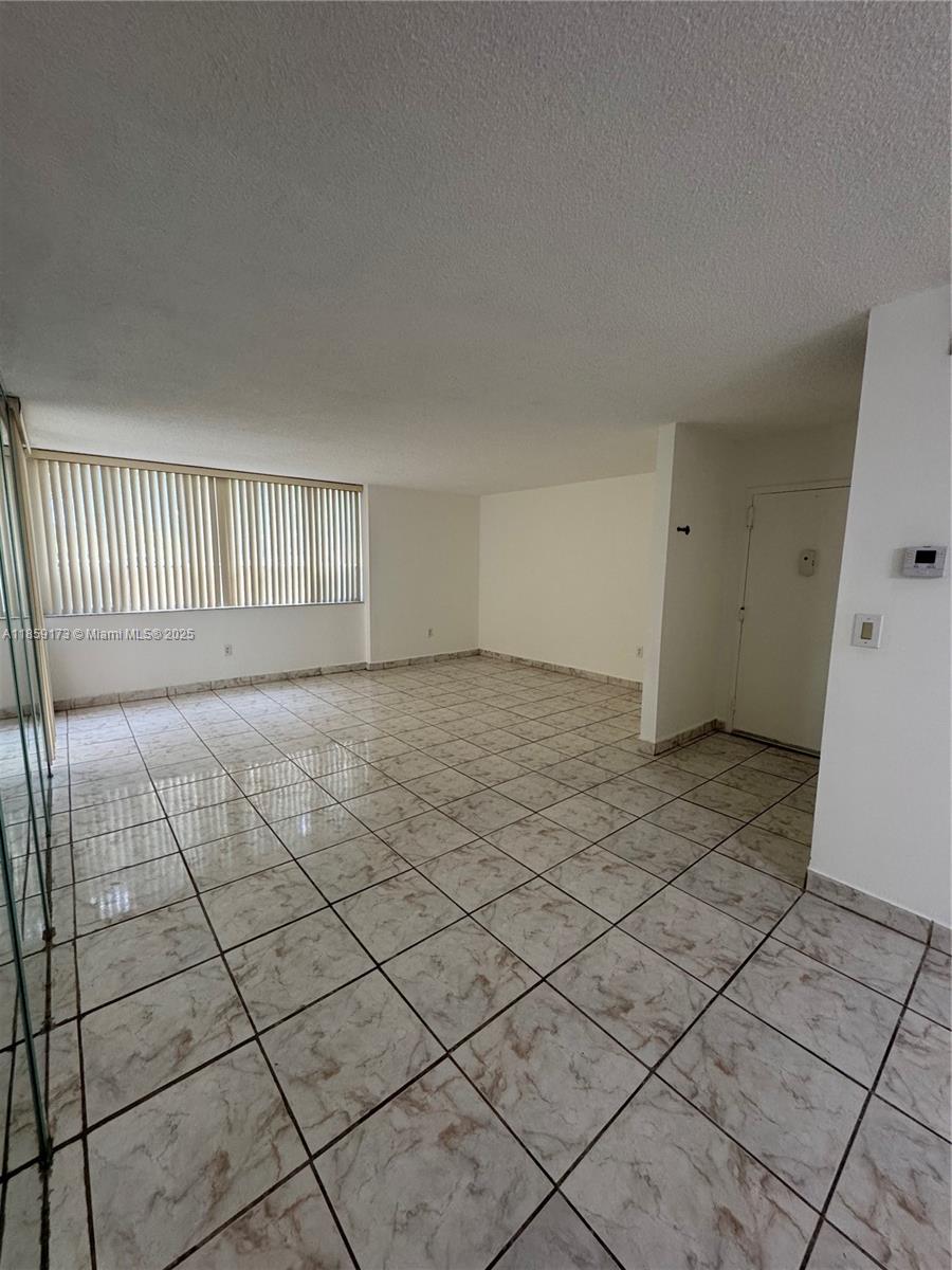 6841 Southwest 147th Avenue, Unit 1H Miami, FL 33193 - Photo 3 of 26 a view of a livingroom with a window