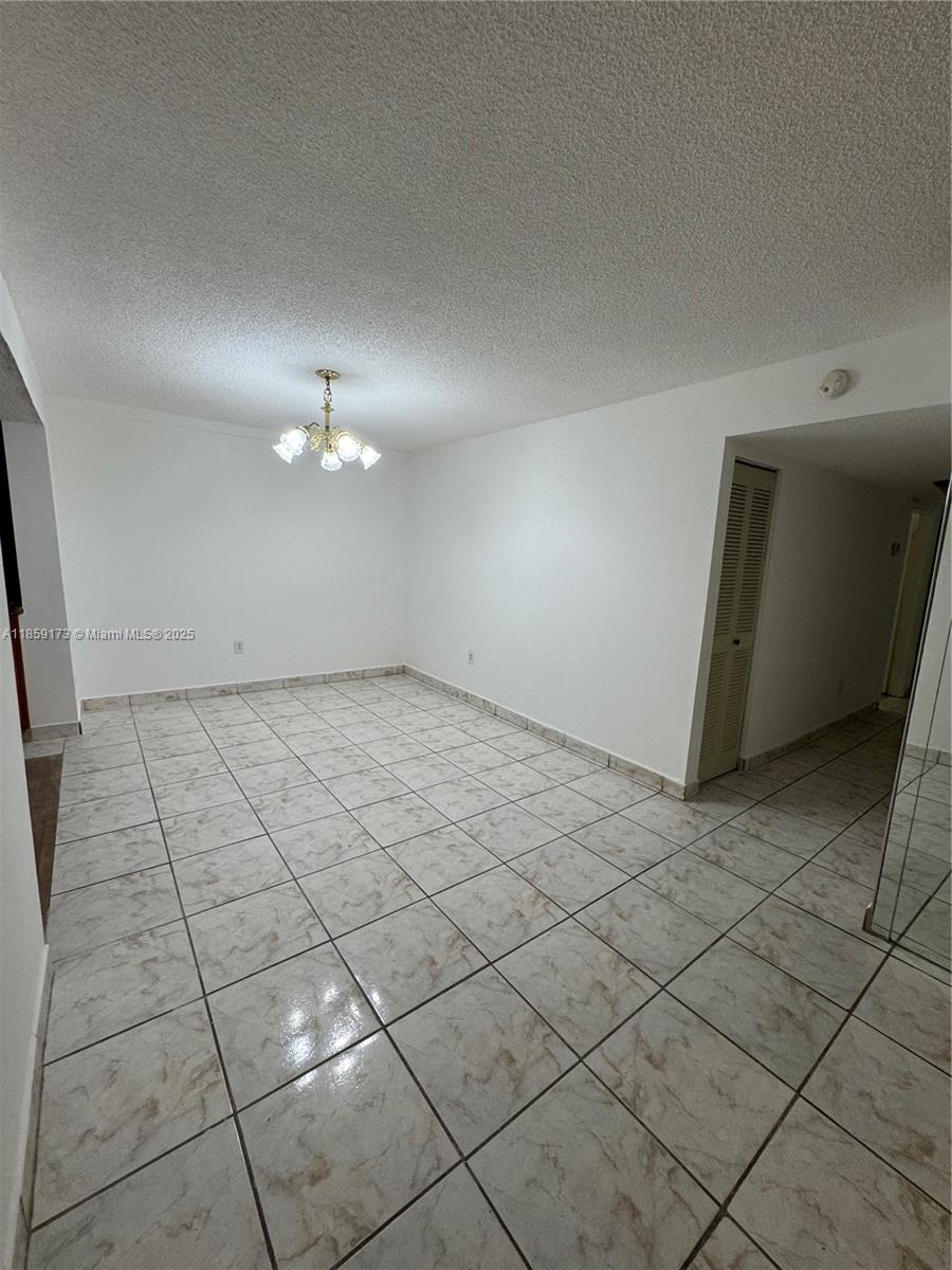 6841 Southwest 147th Avenue, Unit 1H Miami, FL 33193 - Photo 7 of 26 a view of an empty room