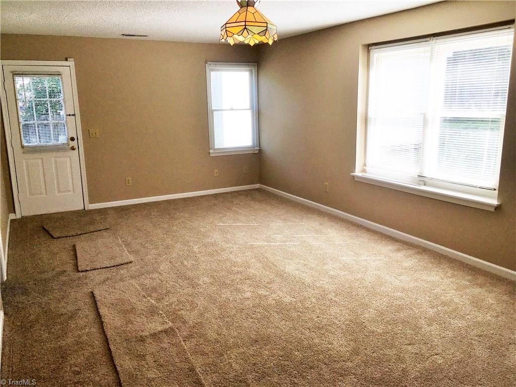5905 High View Road Greensboro, NC 27410 - Photo 11 of 22 Downstairs you have the family room,man cave, den, or whatever you want to use the space for. Walk out to the side yard.