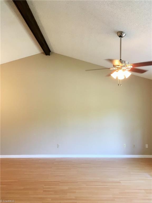 5905 High View Road Greensboro, NC 27410 - Photo 10 of 22 Natural light and vaulted ceilings in the main living room.