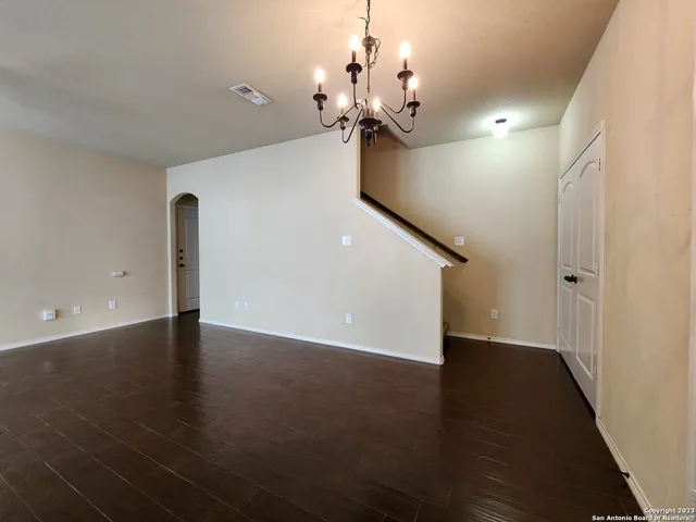 a view of a room with wooden floor