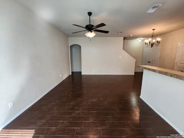 a view of a livingroom with a kitchen
