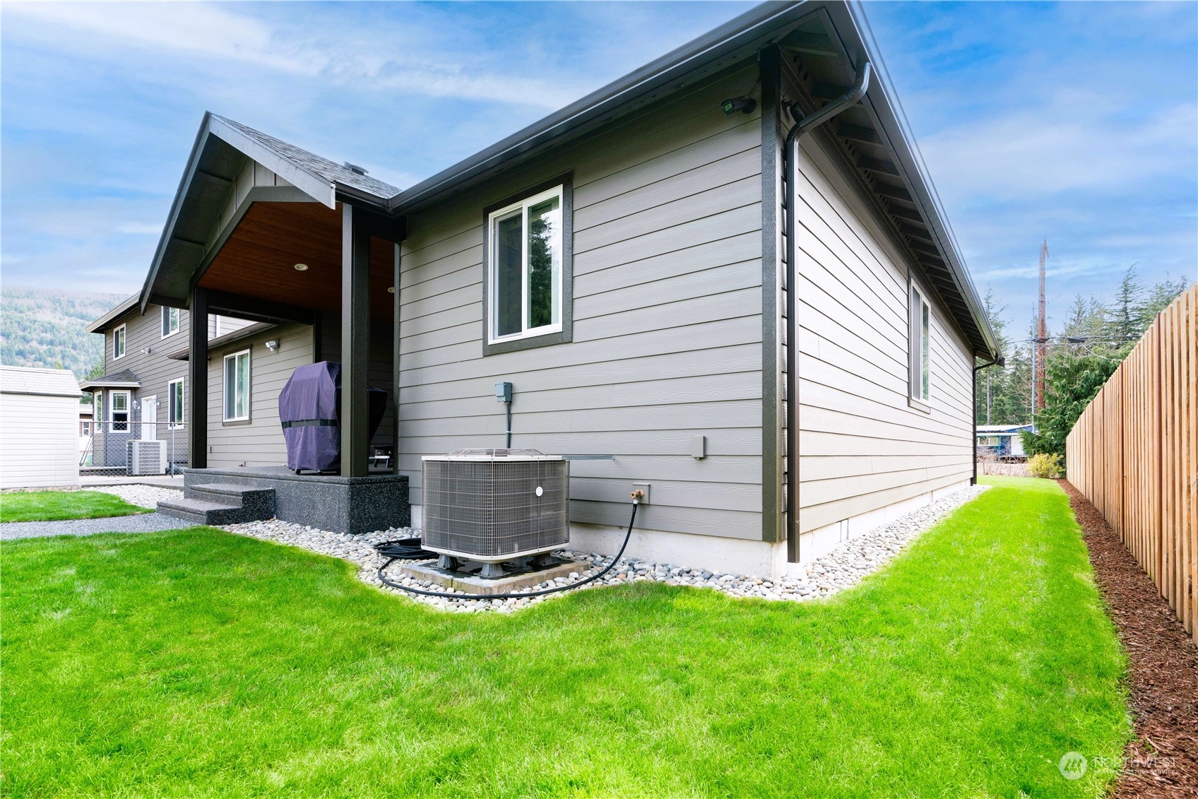 8487 Cimarron Way Maple Falls, WA 98266 - Photo 12 of 39 a view of backyard with a barbeque grill and a garden