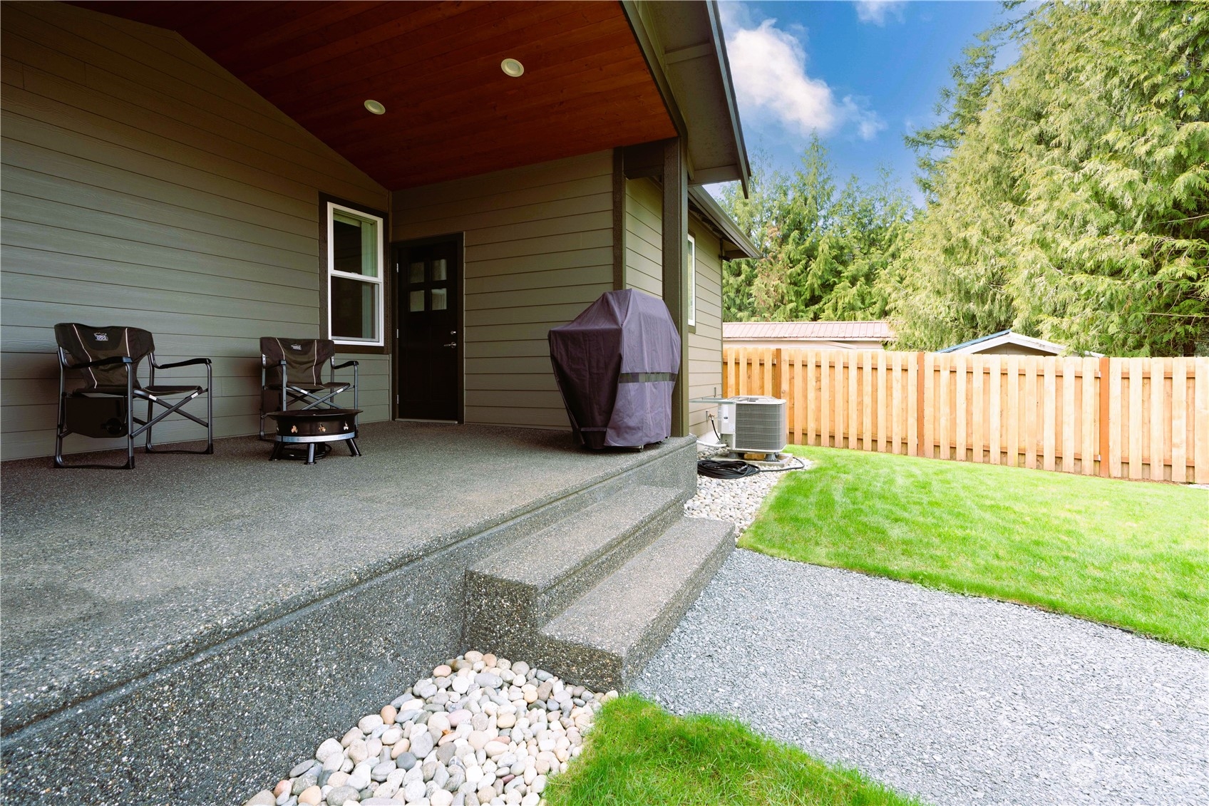 8487 Cimarron Way Maple Falls, WA 98266 - Photo 13 of 39 a view of backyard with deck and outdoor seating