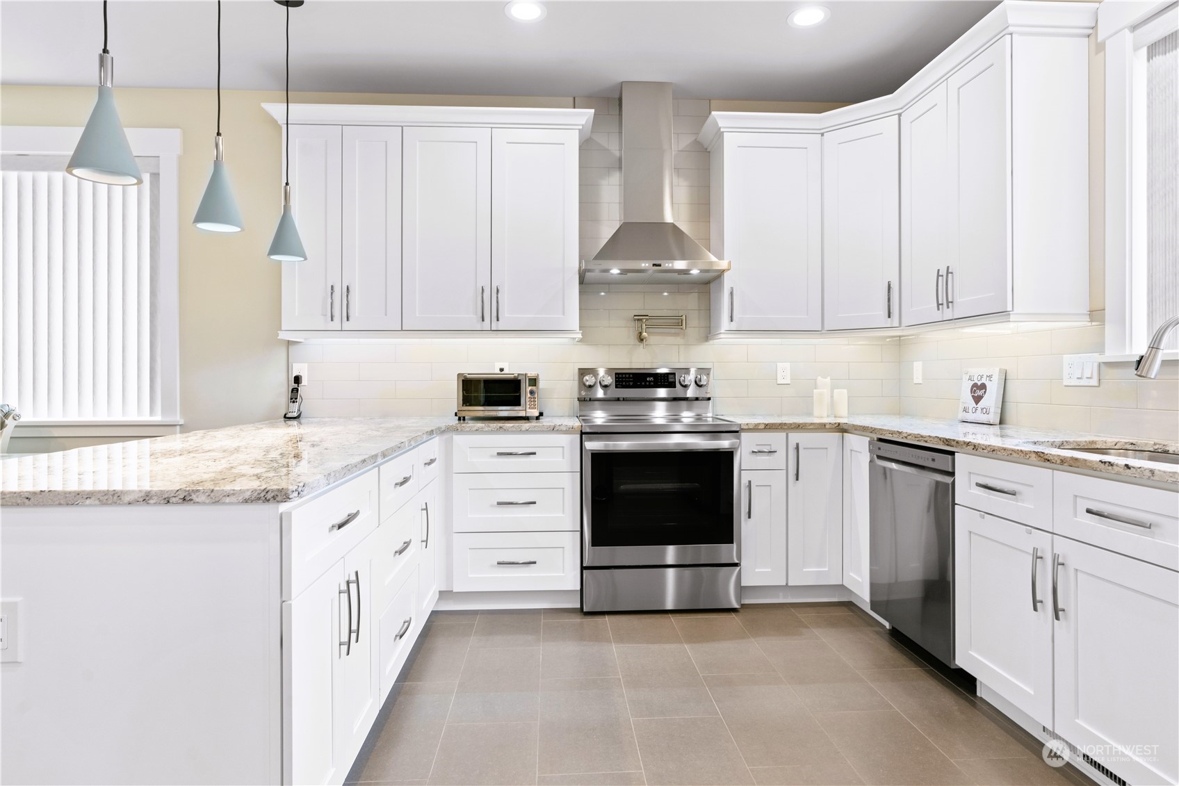 8487 Cimarron Way Maple Falls, WA 98266 - Photo 19 of 39 a kitchen with granite countertop a sink stove and cabinets