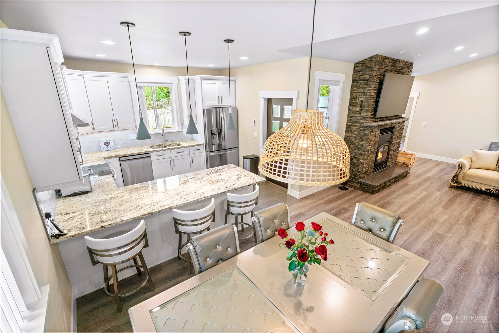8487 Cimarron Way Maple Falls, WA 98266 - Photo 20 of 39 a living room with hard wood flooring furniture and a chandelier
