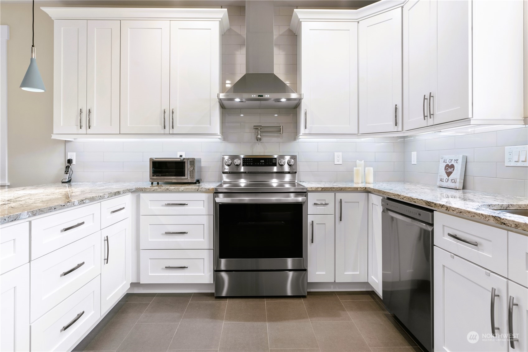 8487 Cimarron Way Maple Falls, WA 98266 - Photo 21 of 39 a kitchen with white cabinets and appliances