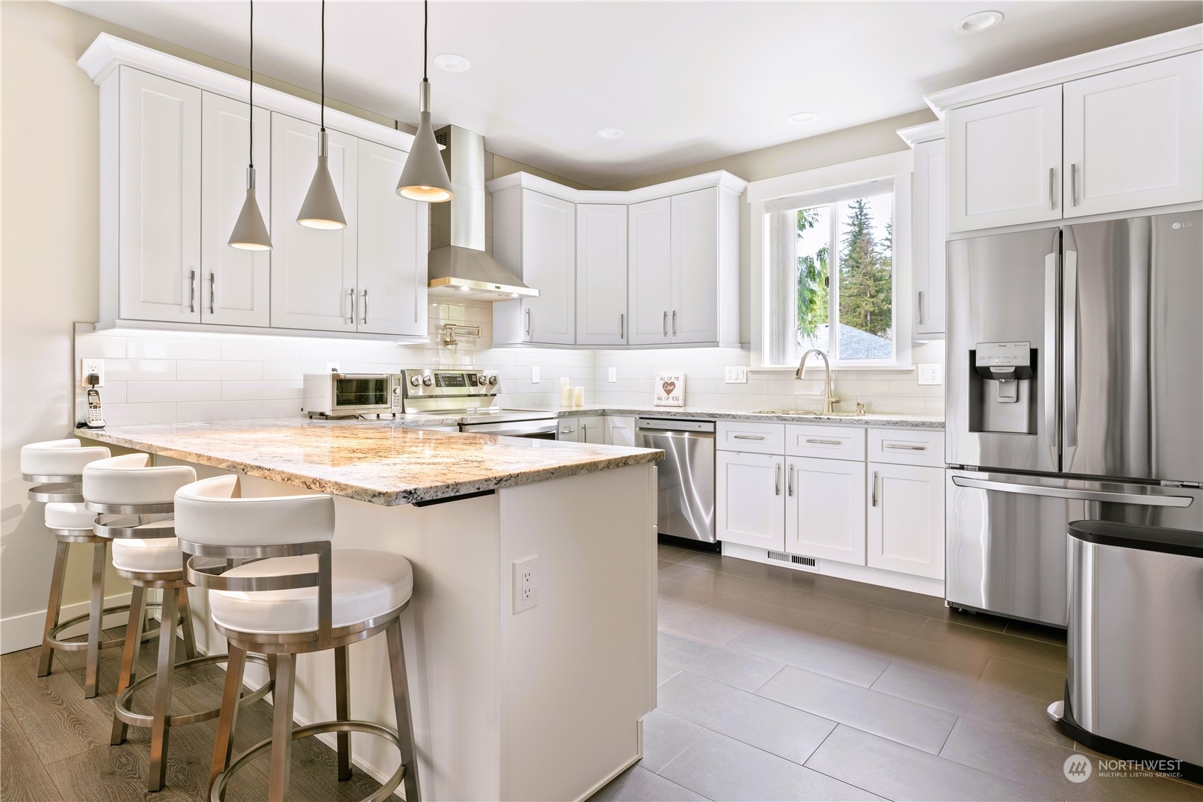 8487 Cimarron Way Maple Falls, WA 98266 - Photo 27 of 39 a kitchen with a sink window and cabinets