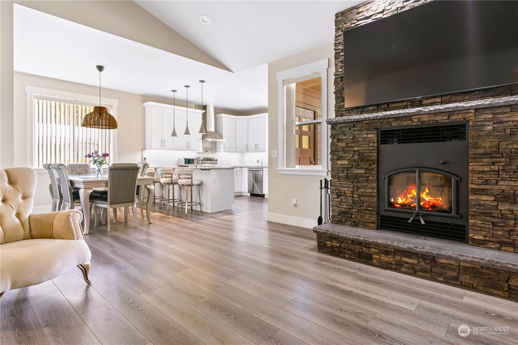 8487 Cimarron Way Maple Falls, WA 98266 - Photo 3 of 39 a living room with furniture a flat screen tv and a fireplace