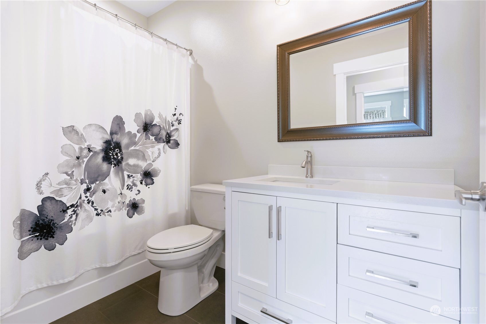 8487 Cimarron Way Maple Falls, WA 98266 - Photo 32 of 39 a bathroom with a toilet sink and mirror