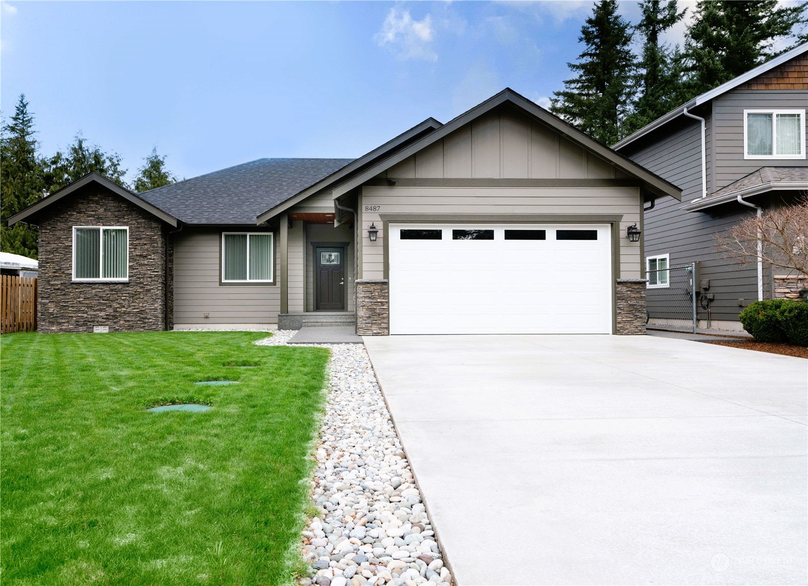 8487 Cimarron Way Maple Falls, WA 98266 - Photo 39 of 39 a front view of a house with a yard and garage