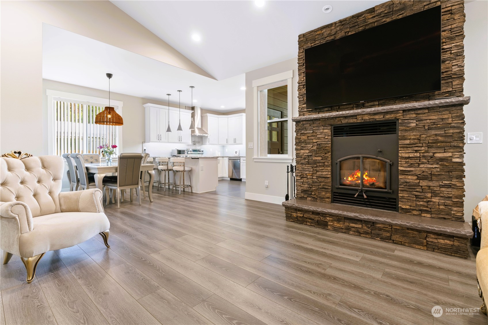 8487 Cimarron Way Maple Falls, WA 98266 - Photo 4 of 39 a living room with furniture a flat screen tv and a fireplace