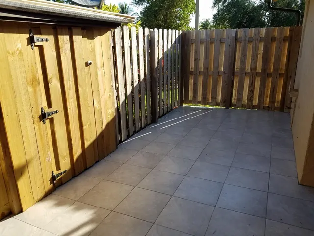 a view of a porch with wooden floor