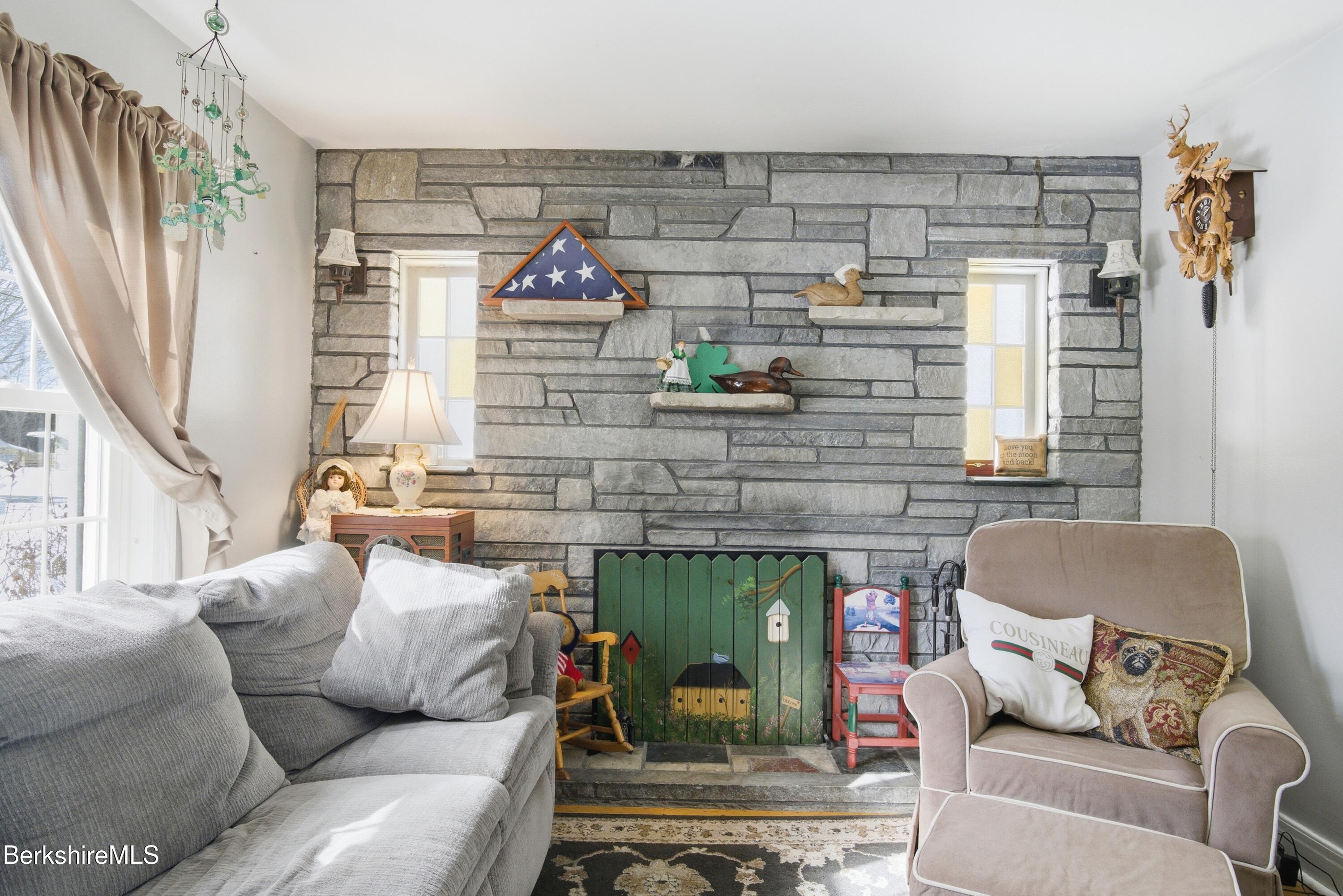 53 Edison Avenue Pittsfield, MA 01201 - Photo 5 of 45 a living room with furniture and a fireplace