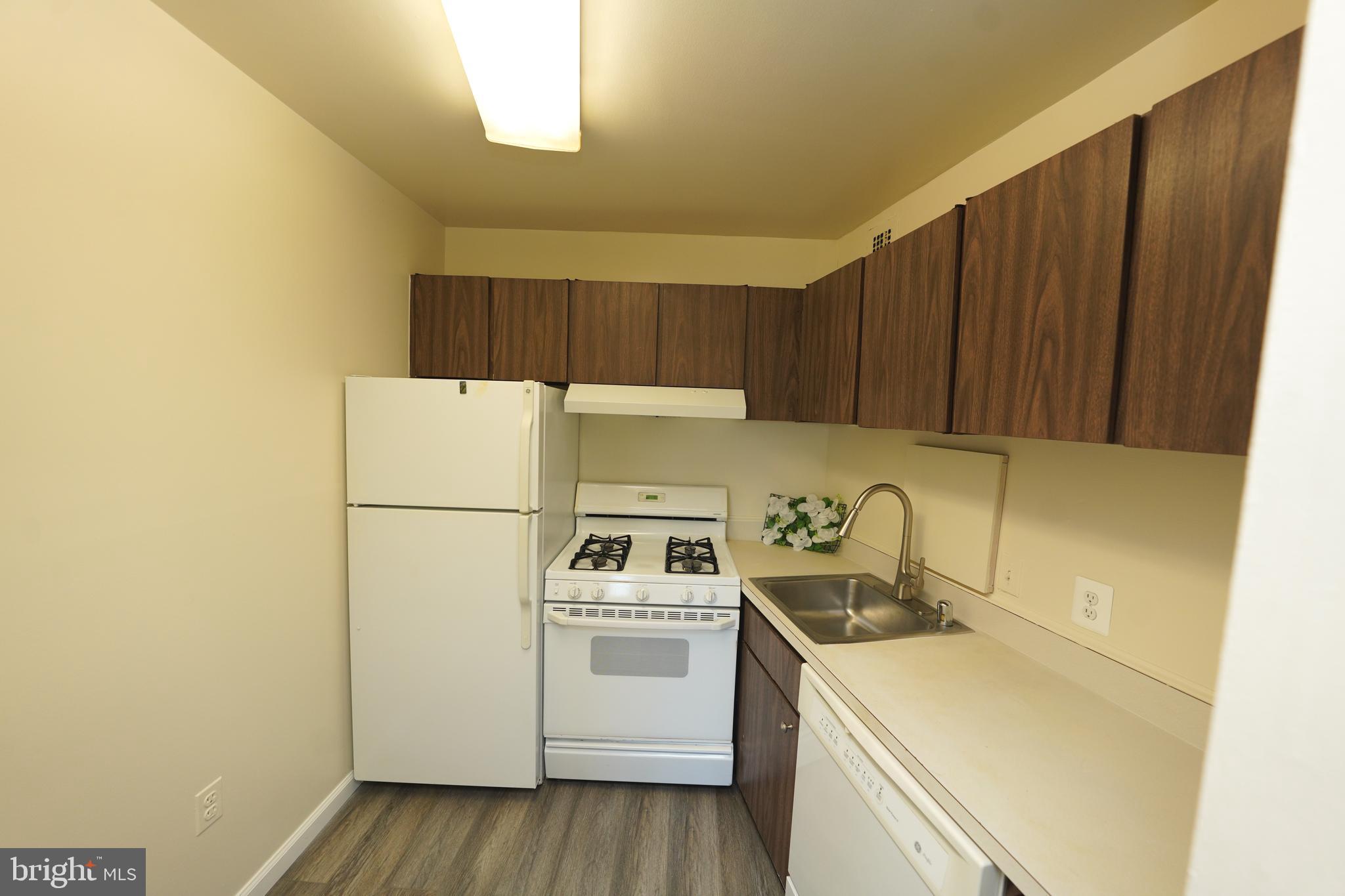 1111 University Boulevard West, Unit 1001A Silver Spring, MD 20902 - Photo 11 of 27 a utility room with dryer and washer