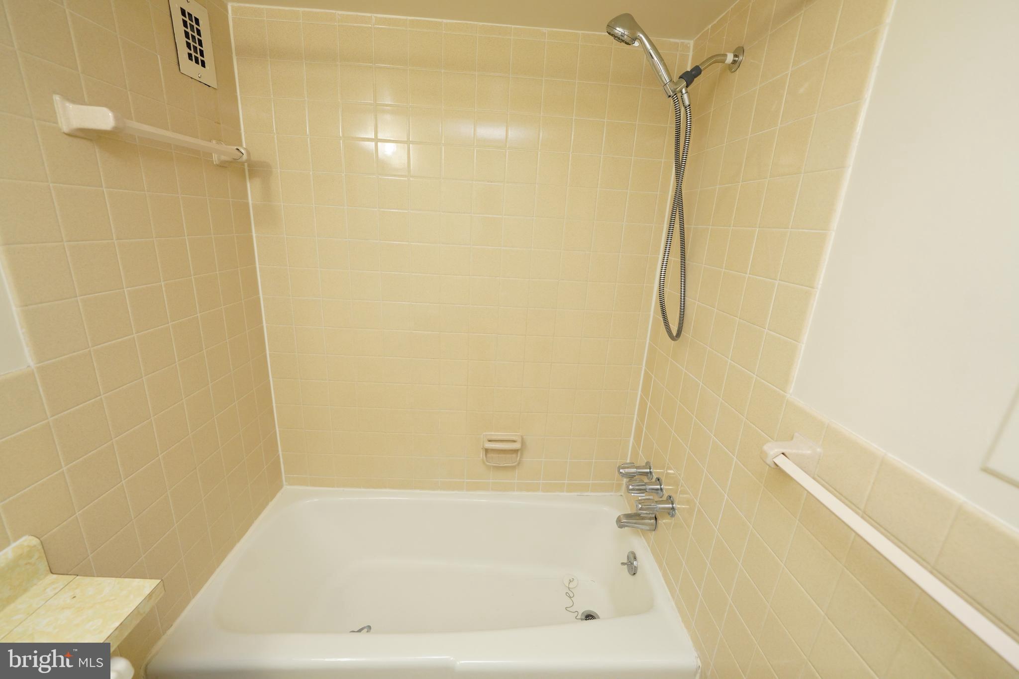 1111 University Boulevard West, Unit 1001A Silver Spring, MD 20902 - Photo 22 of 27 a bathroom with a bathtub