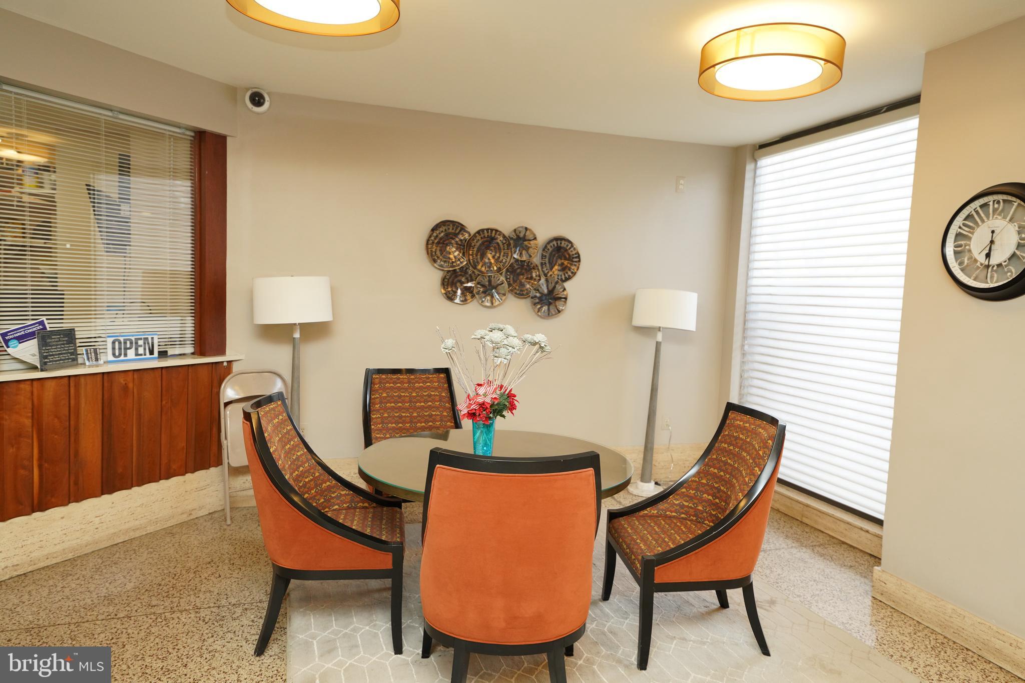 1111 University Boulevard West, Unit 1001A Silver Spring, MD 20902 - Photo 7 of 27 a dining room with furniture and window