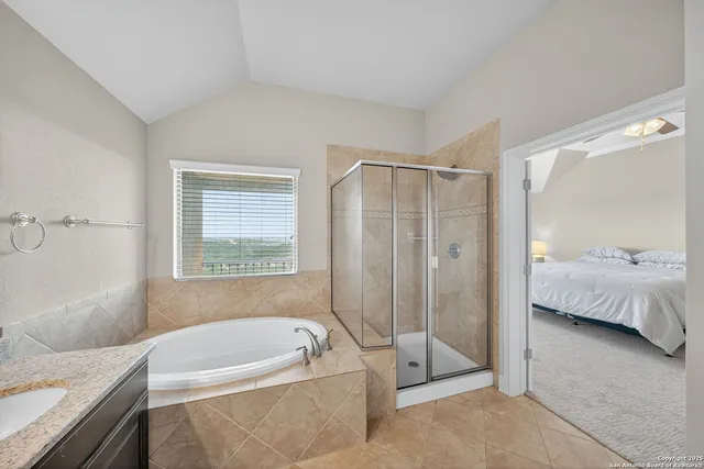 a bathroom with a tub shower and sink