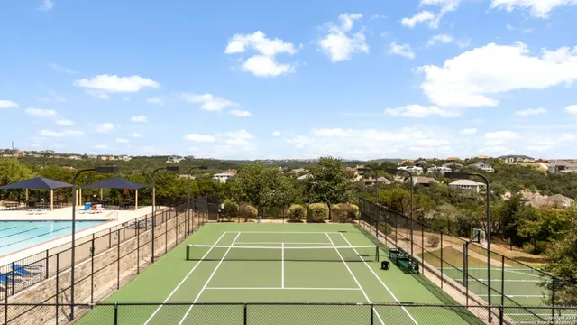 a view of a swimming pool with a patio