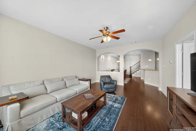 a living room with furniture and a rug