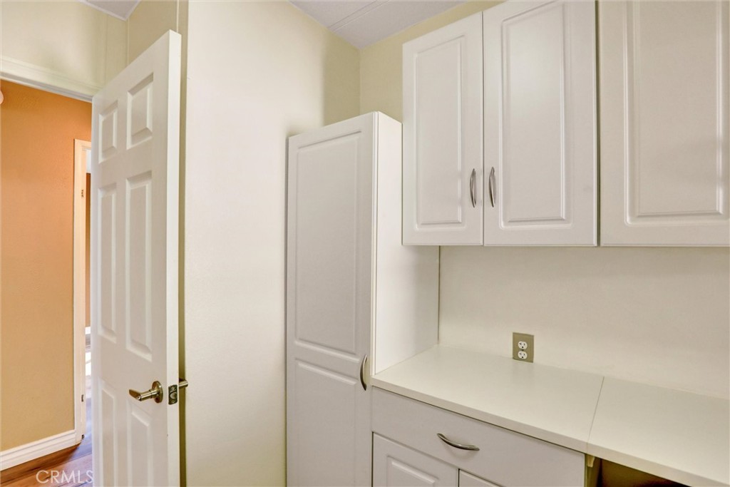 7700 Lampson Avenue, Unit 71 Garden Grove, CA 92841 - Photo 19 of 24 a view of cabinets with wooden floor