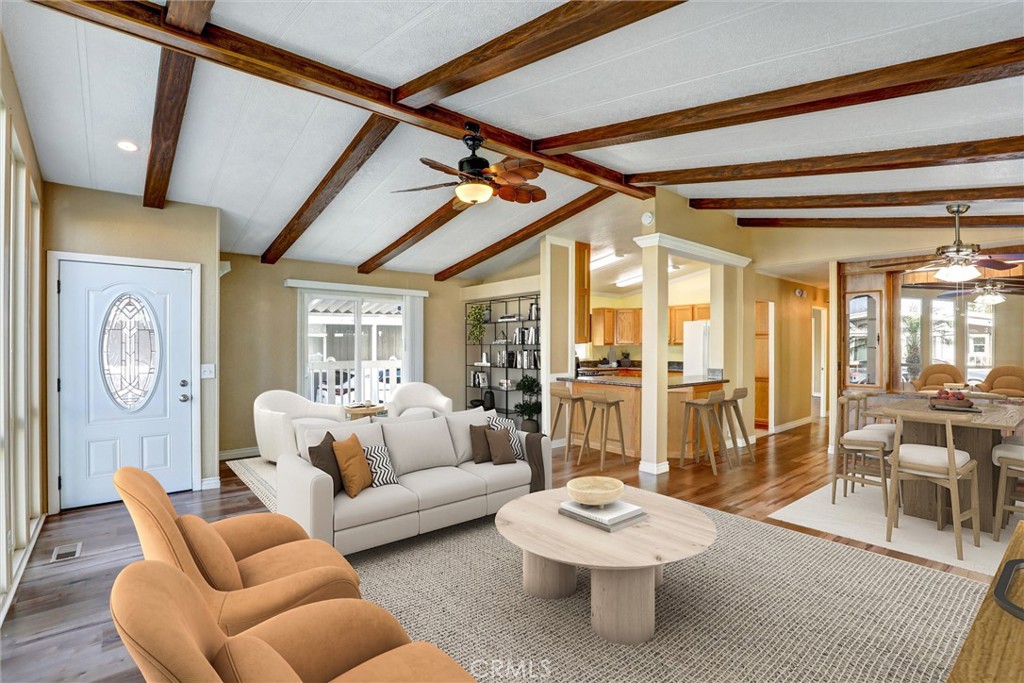 7700 Lampson Avenue, Unit 71 Garden Grove, CA 92841 - Photo 4 of 24 a living room with furniture a table and chairs
