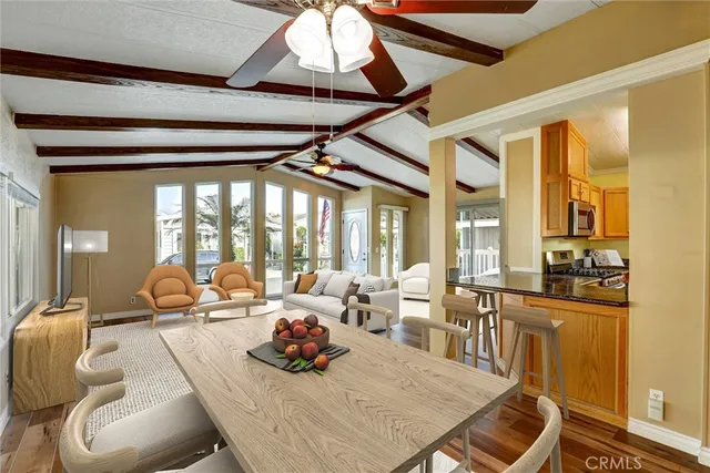 a room with furniture and large windows