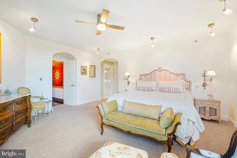 a bedroom with furniture and wooden floor