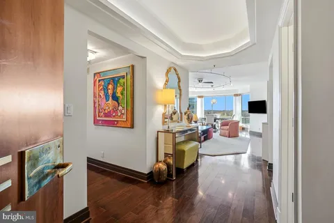 a view of a livingroom with furniture and a flat screen tv