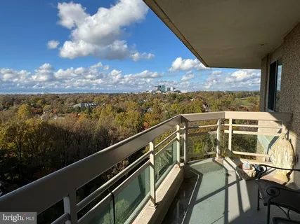 a view of a balcony with chairs