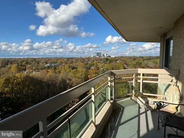 a view of a balcony with chairs