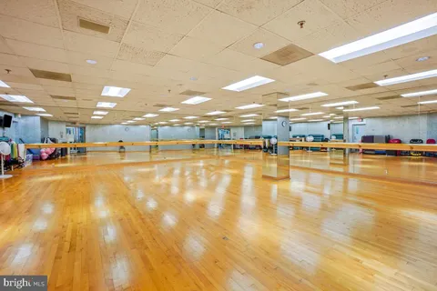 a view of a room with furniture and a wooden floor