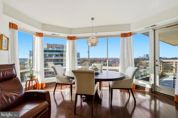 a view of a dining room with furniture window and wooden floor