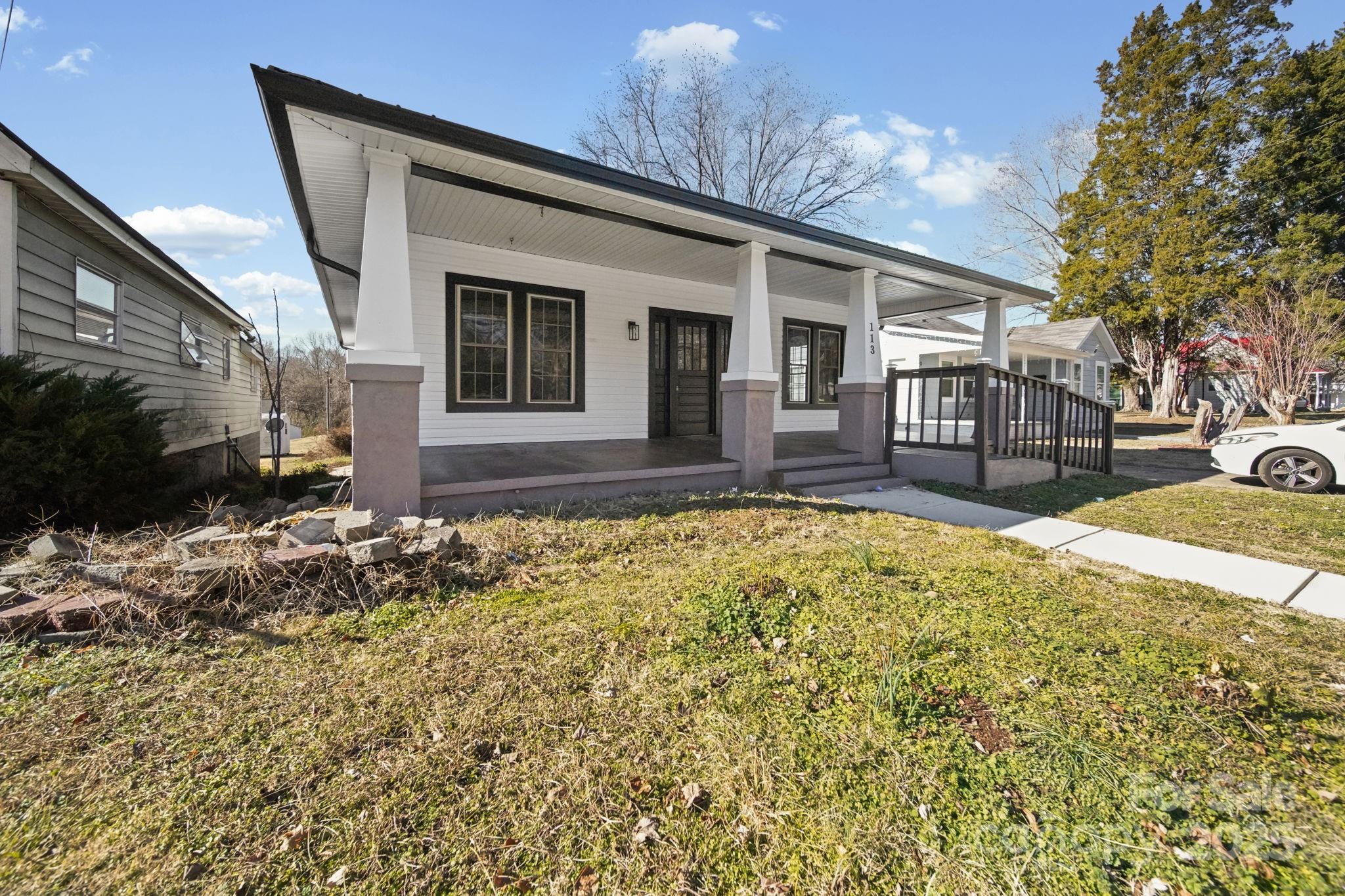 113 7th Street Spencer, NC 28159 - Photo 2 of 44 a front view of house with yard outdoor seating and barbeque oven