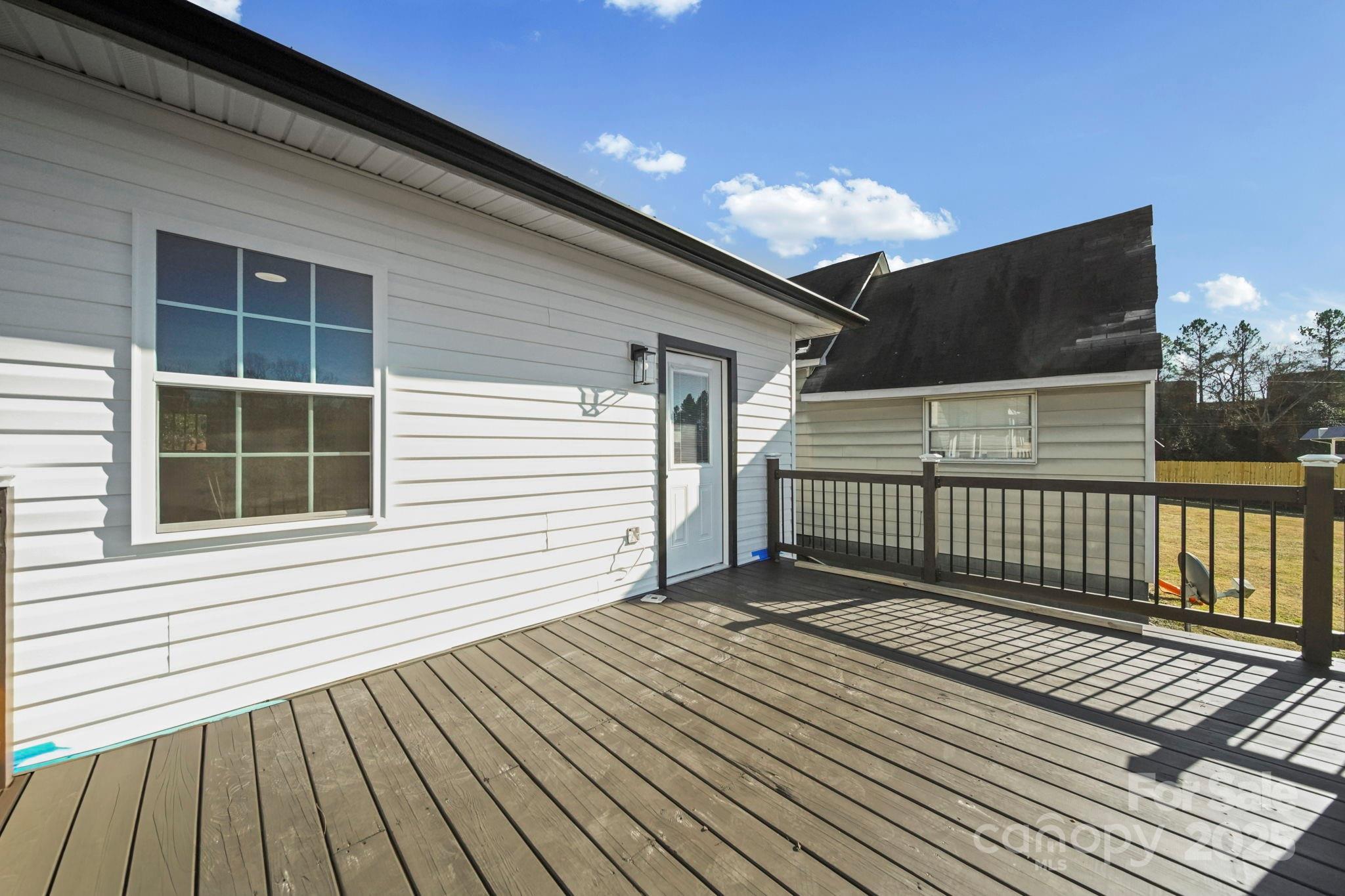 113 7th Street Spencer, NC 28159 - Photo 26 of 44 a view of backyard with a balcony