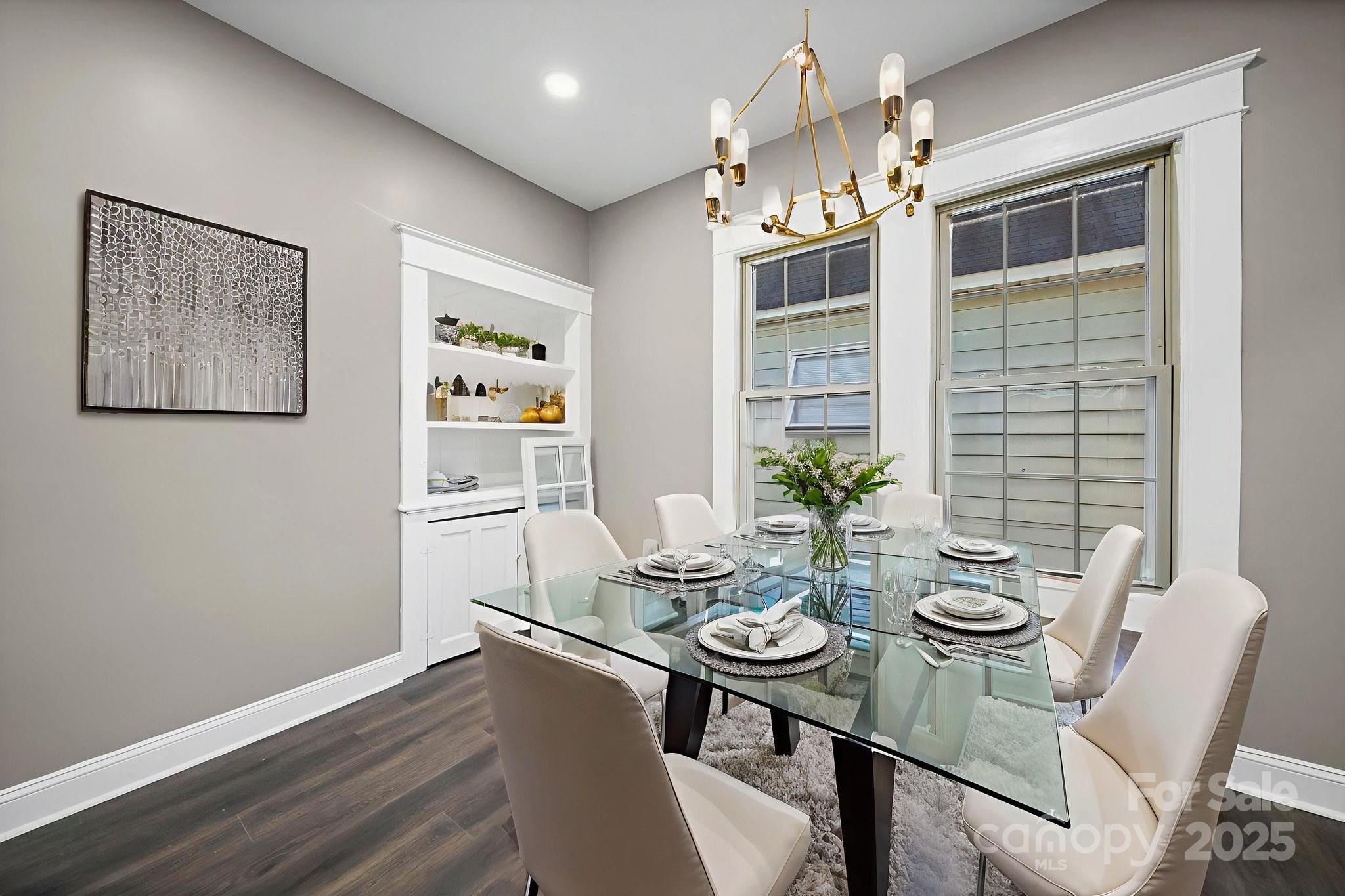 113 7th Street Spencer, NC 28159 - Photo 31 of 44 a view of a dining room with furniture wooden floor and chandelier