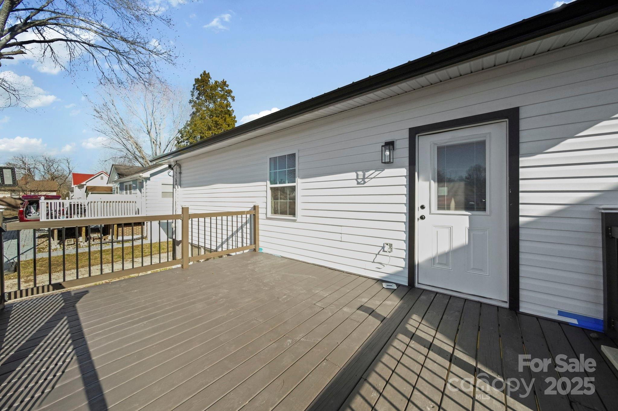 113 7th Street Spencer, NC 28159 - Photo 33 of 44 a view of a balcony with wooden floor