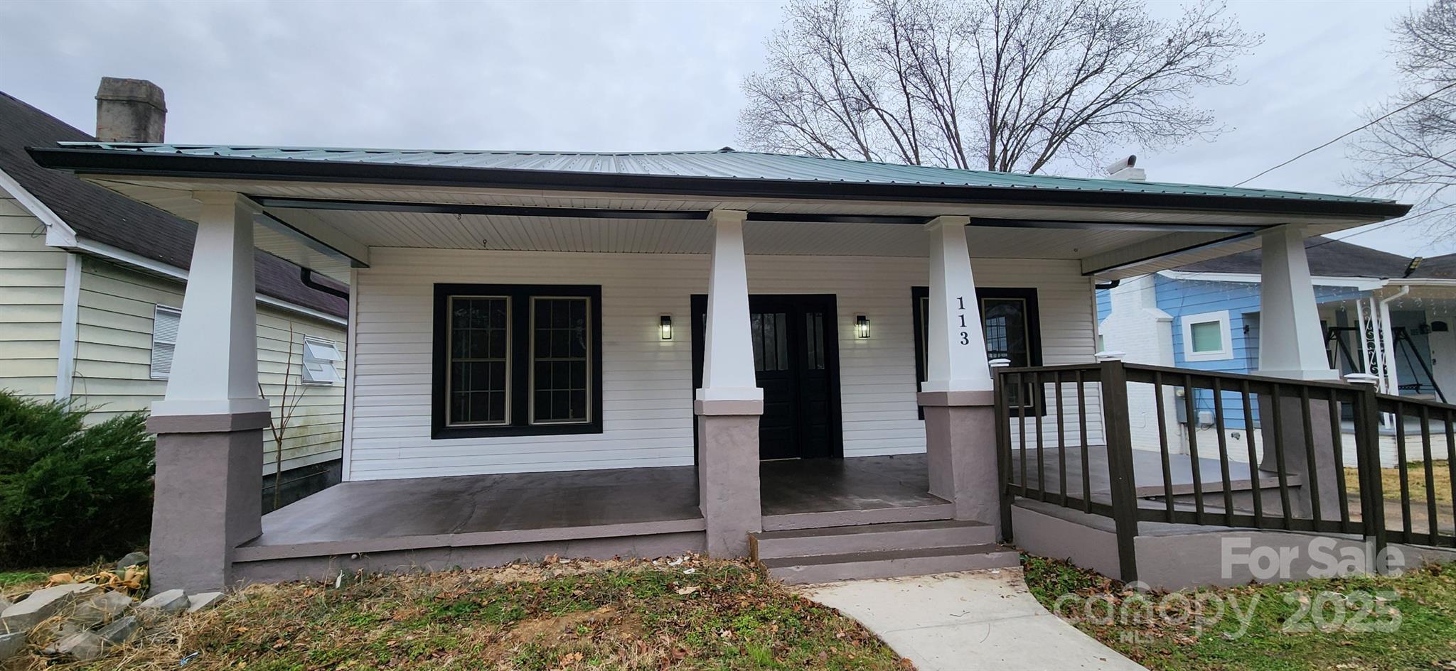 113 7th Street Spencer, NC 28159 - Photo 4 of 44 a front view of a house with a porch