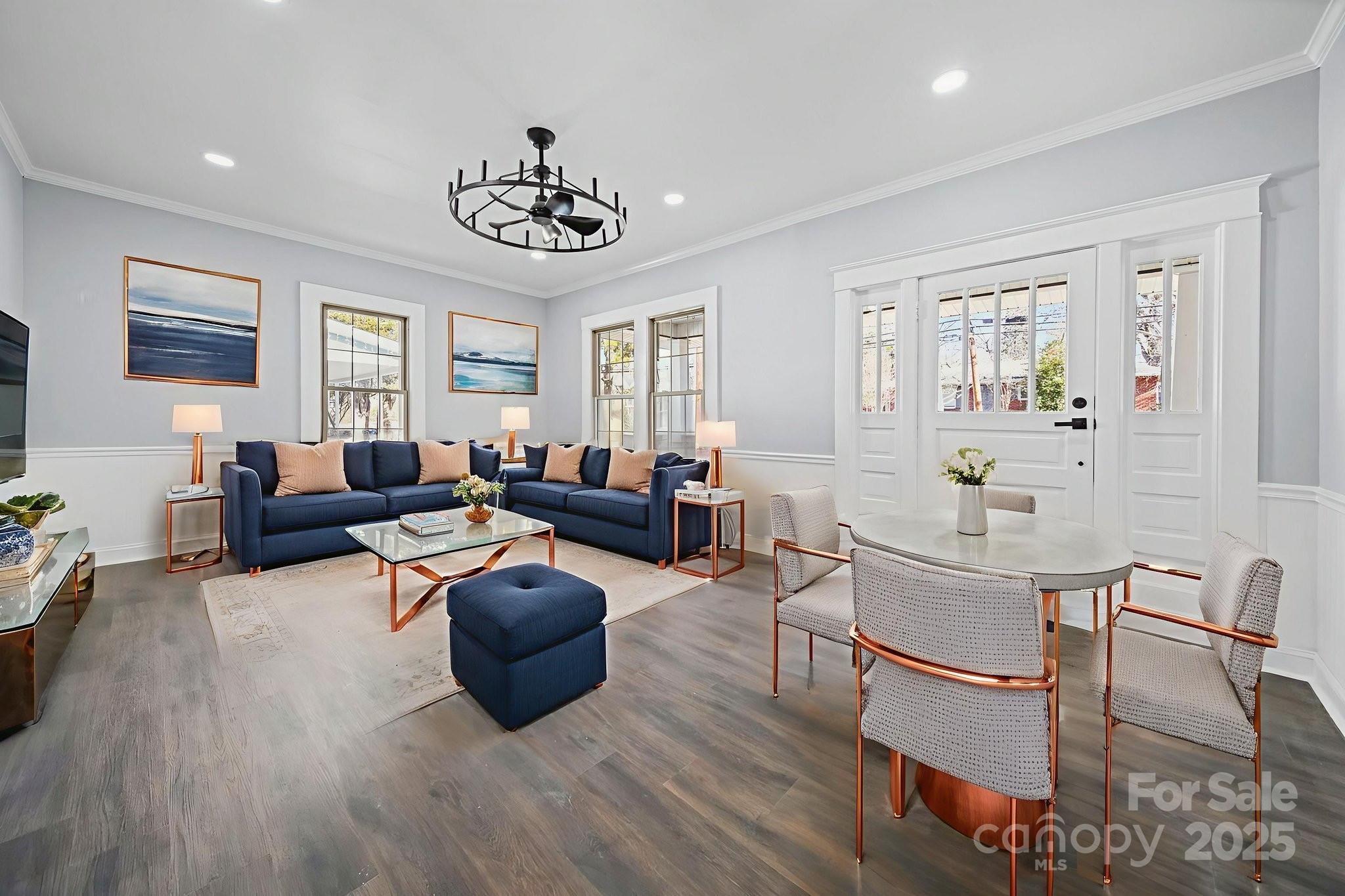 113 7th Street Spencer, NC 28159 - Photo 41 of 44 a living room with fireplace furniture and a wooden floor