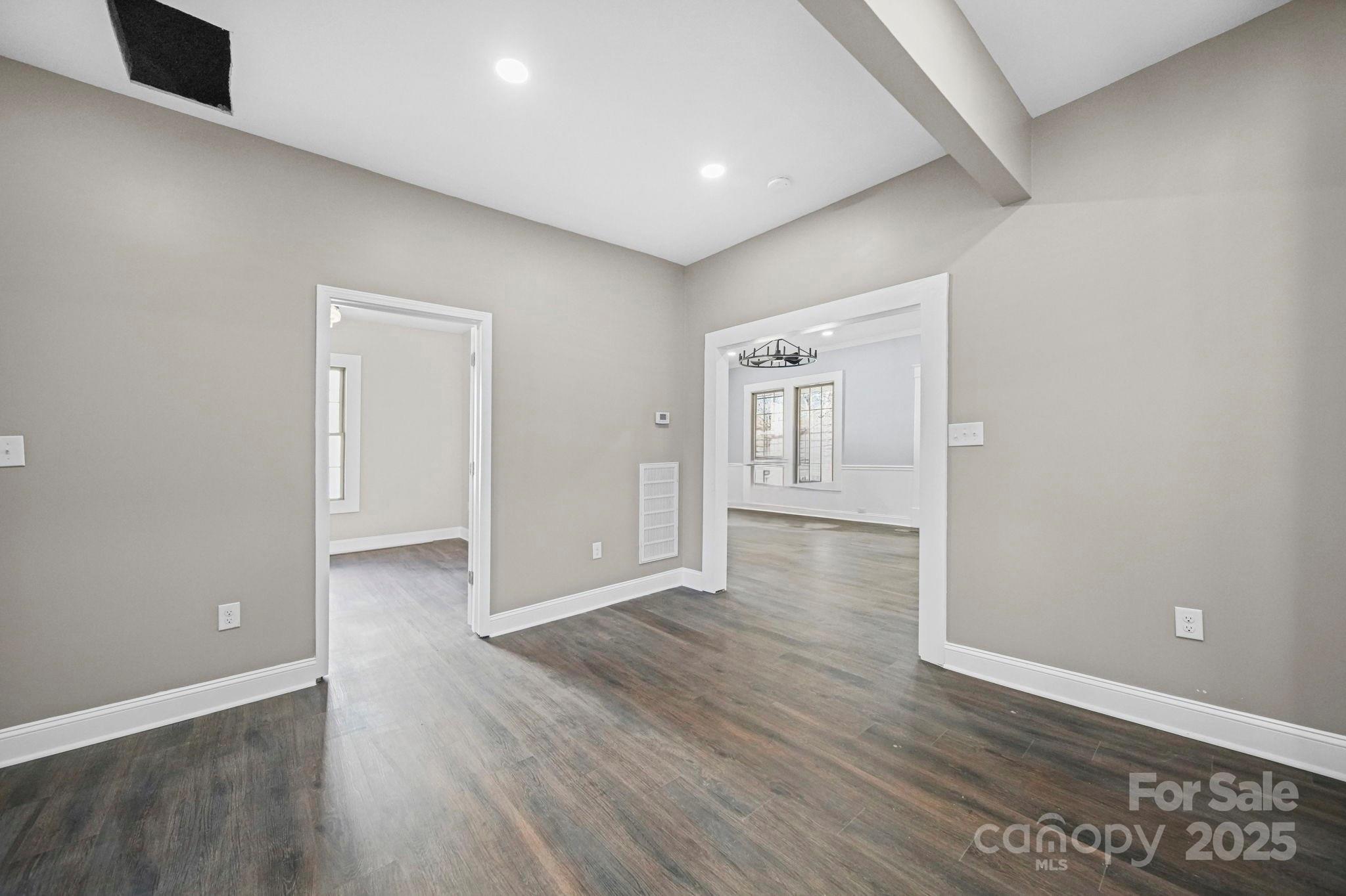 113 7th Street Spencer, NC 28159 - Photo 8 of 44 wooden floor in an empty room with a window
